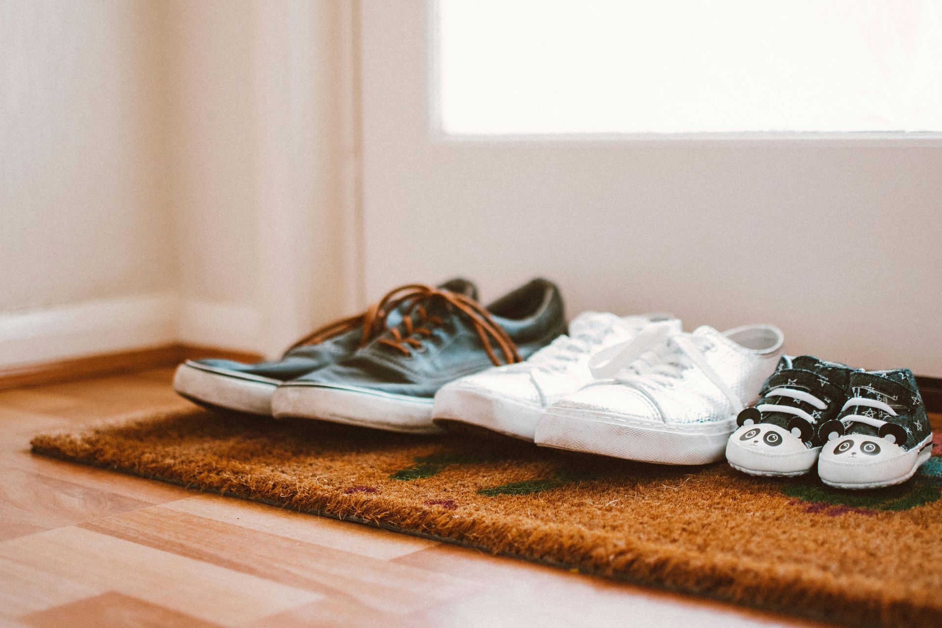 3 pairs of shoes on door mat in home kingswinford