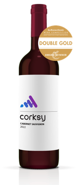 A bottle of wine with a double gold sticker on it.
