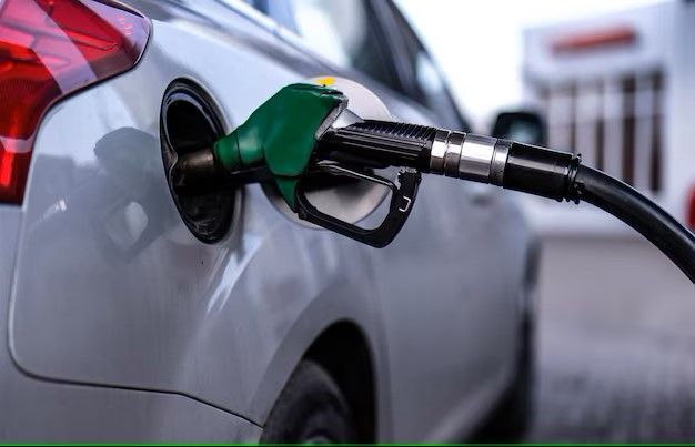 A car is being filled with gas at a gas station.