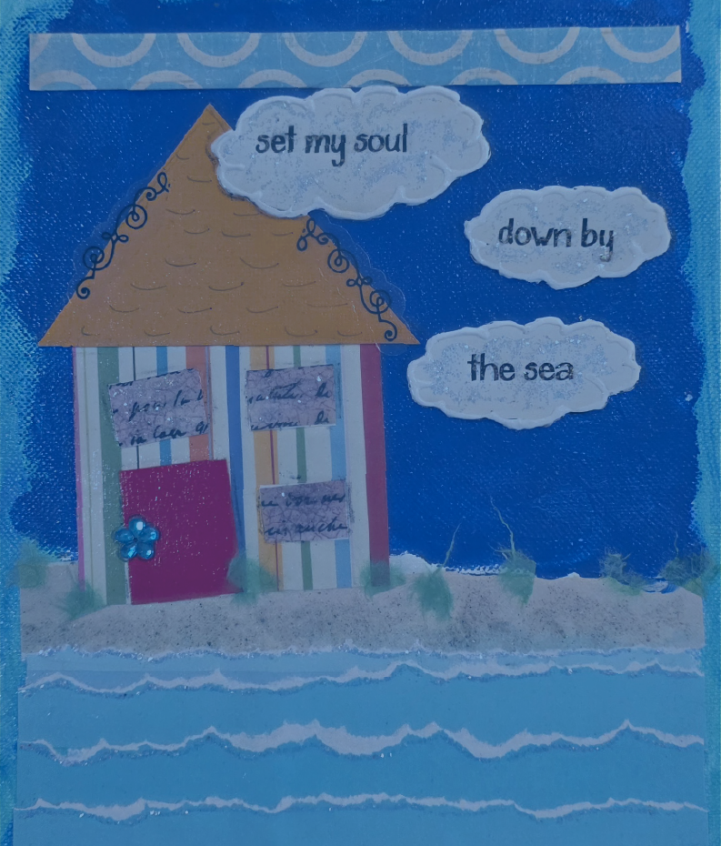 a fabric collage of a house, clouds and water