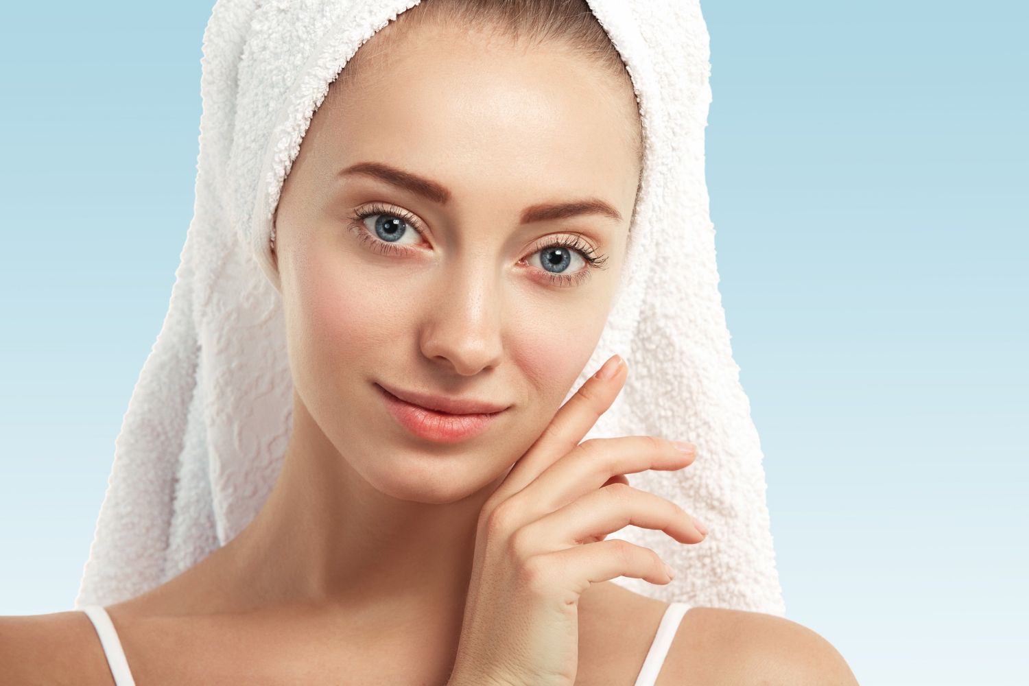 A woman with a towel wrapped around her head.