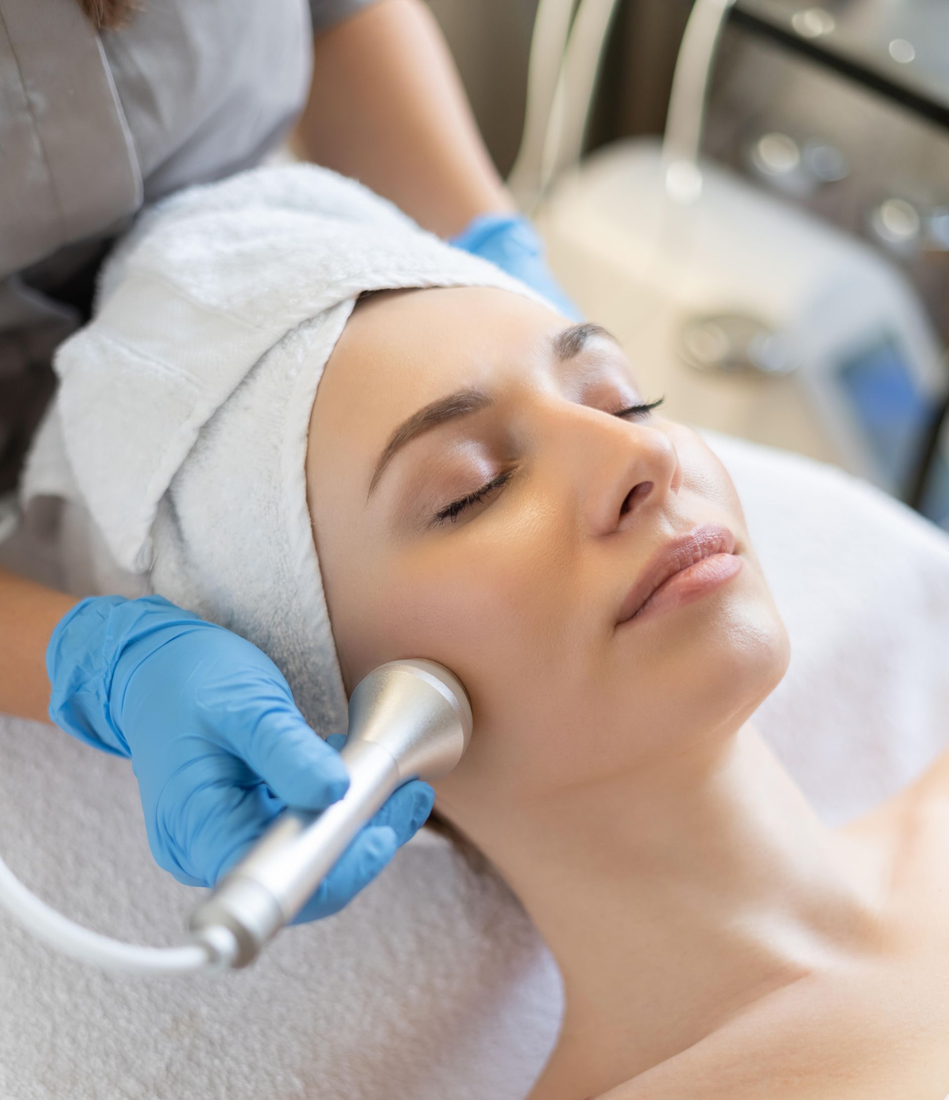 A man is getting a facial treatment at a spa.