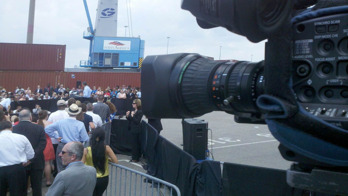 A camera is taking a picture of a crowd of people