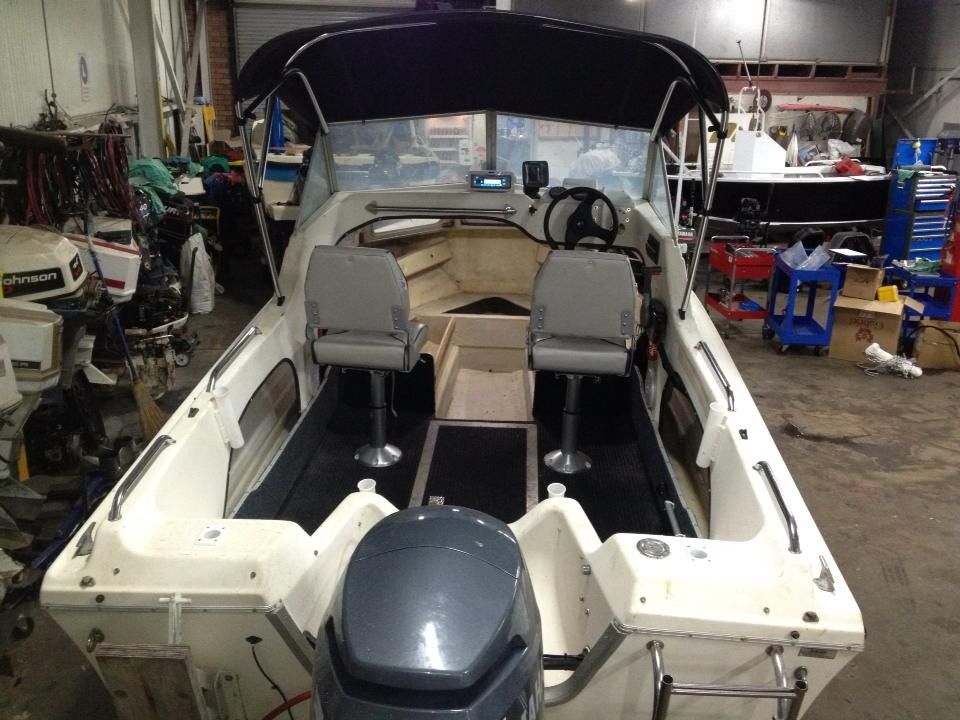 A Boat with A Yamaha Engine Is in A Garage — Don's Marine Repairs in Brisbane Waters, NSW