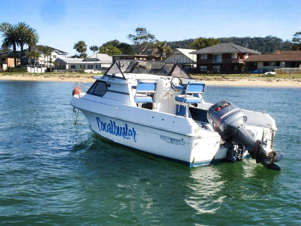 A white boat out in the water — Don's Marine Repairs in Woy Woy, NSW