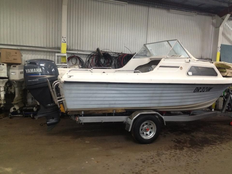 A Yamaha Boat Is Parked on A Trailer in A Garage — Don's Marine Repairs in Gosford, NSW