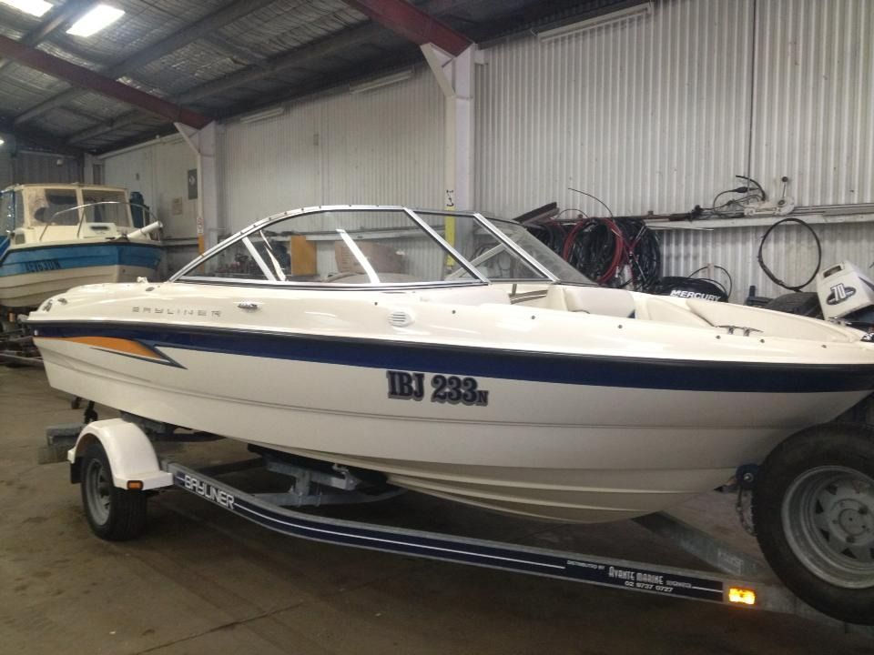 A White and Blue Boat Is Parked — Don's Marine Repairs in Woy Woy, NSW