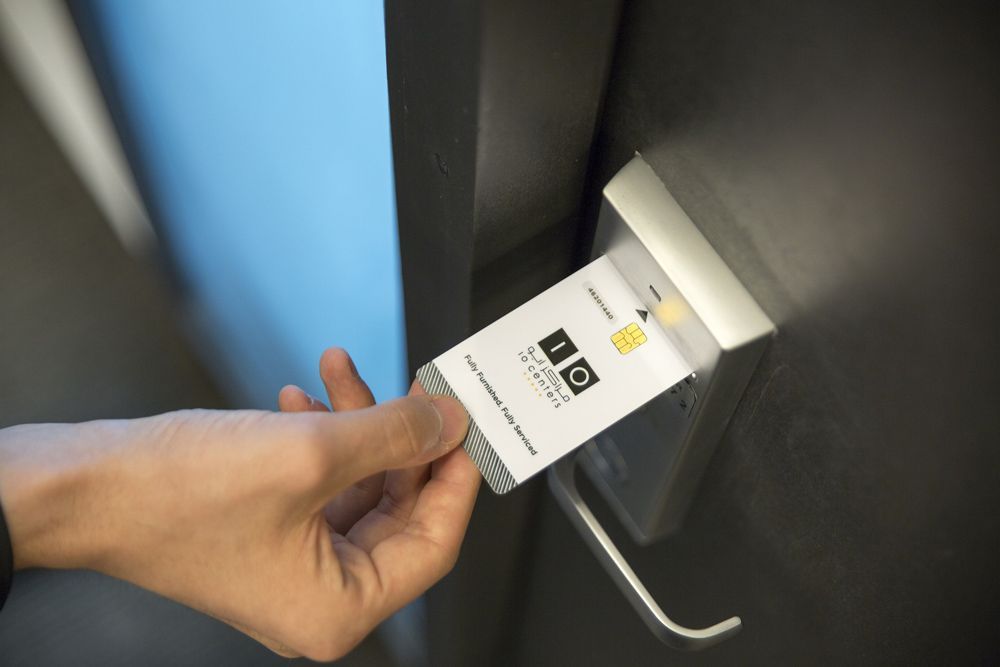Hand Inserting Key Card on Office Smart Lock in Nampa, ID