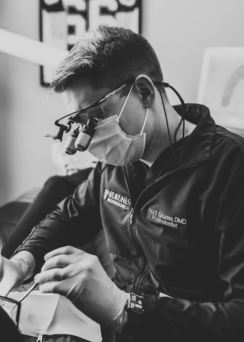 Dentist Choosing The Right Shade Of Teeth For Patient — Pittsburgh, PA — Kukunas Prosthodontics