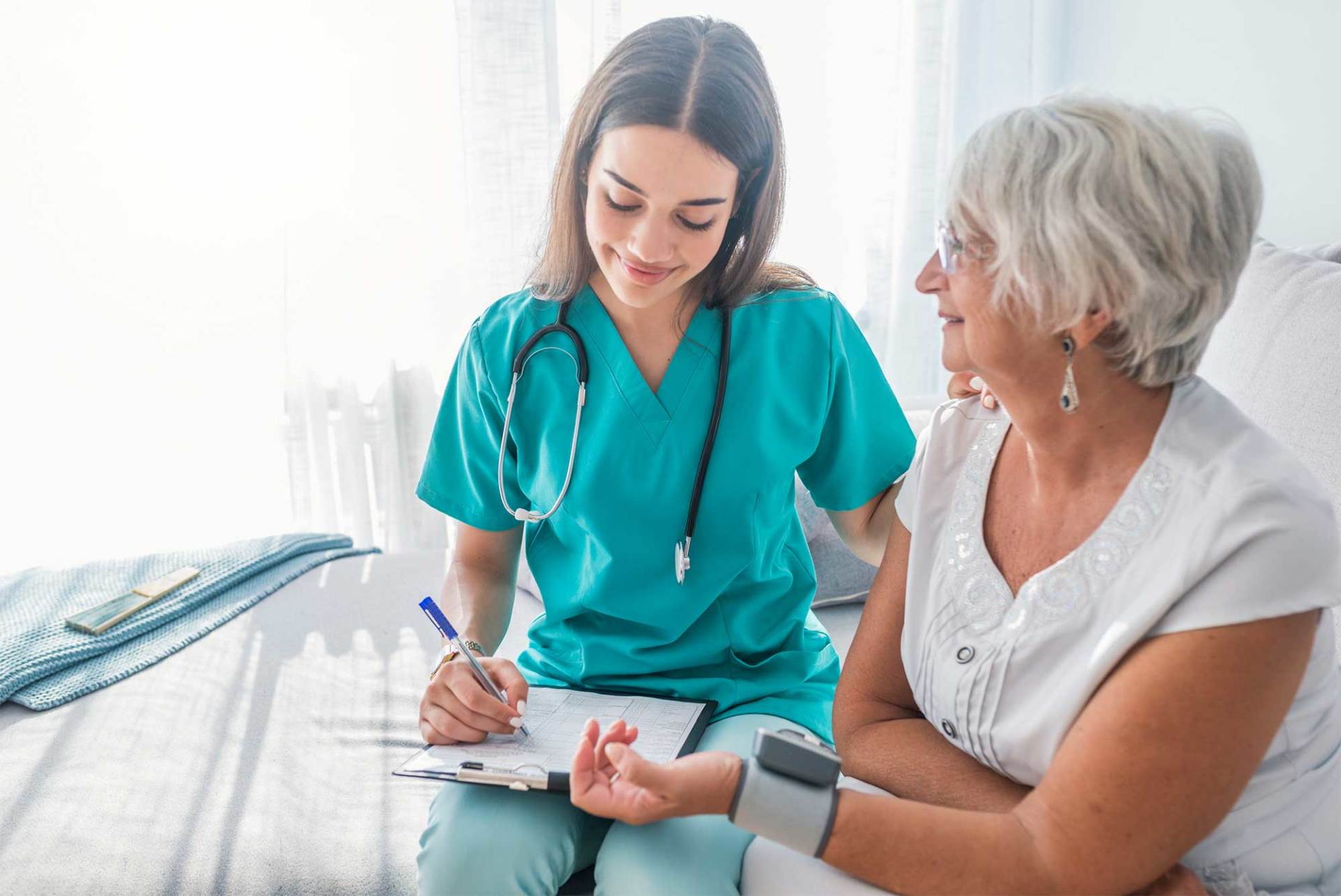 Nurse Measuring Blood Pressure of Senior Woman at Home — St. Paul, Minnesota — Care Plus HHA Nurse Measuring Blood Pressure of Senior Woman at Home — St. Paul, Minnesota — Care Plus HHA
