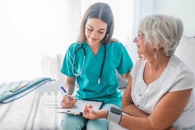Nurse Measuring Blood Pressure of Senior Woman at Home — St. Paul, Minnesota — Care Plus HHA