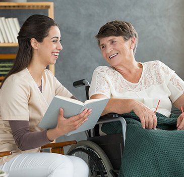 Care Worker Reading A Book — St. Paul, Minnesota — Care Plus HHA Care Worker Reading A Book — St. Paul, Minnesota — Care Plus HHA