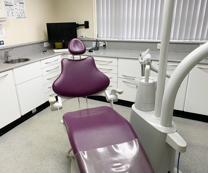 Empty dentist chair and equipment in dental office.