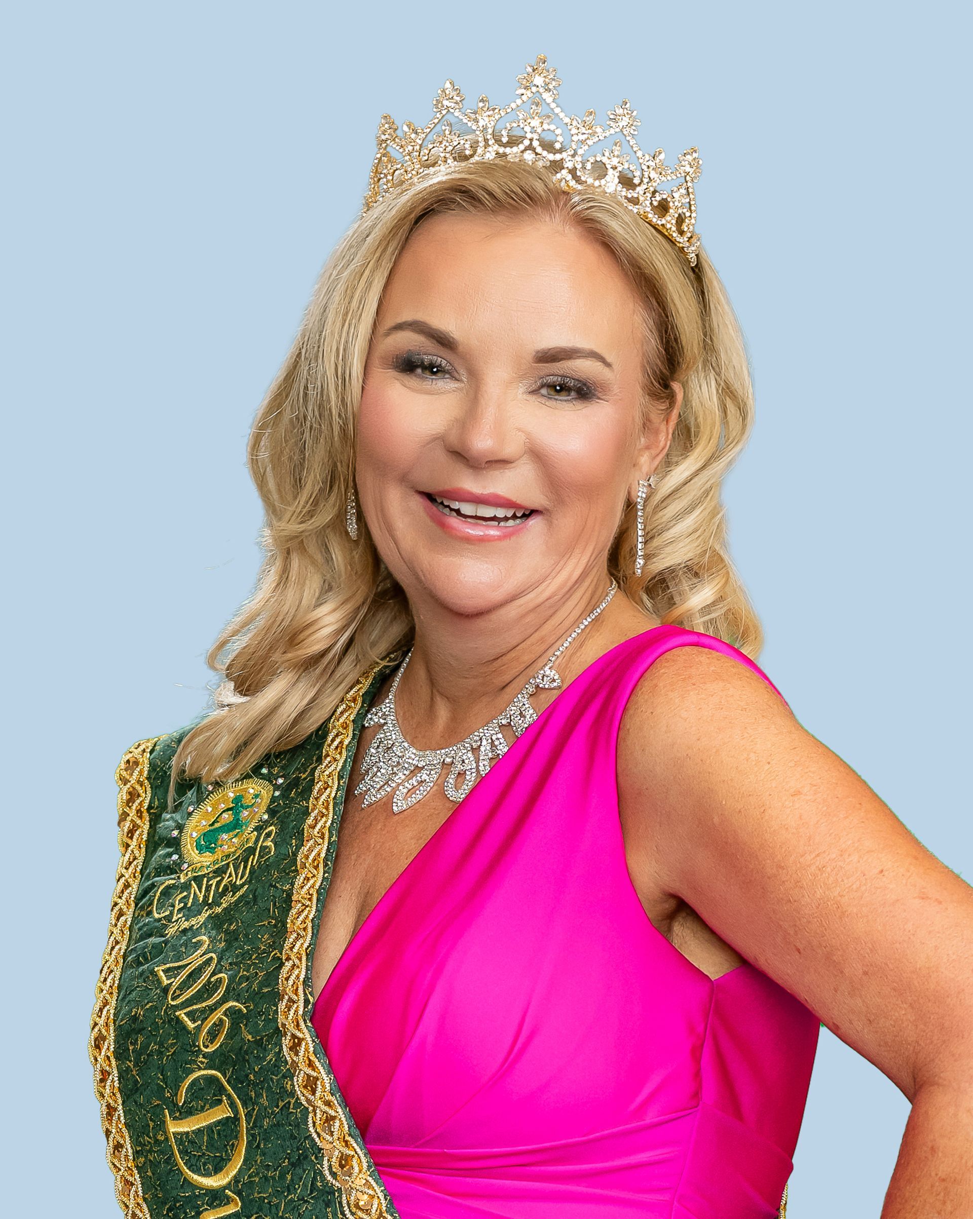 A woman wearing a tiara and a sash with the year 2025 on it