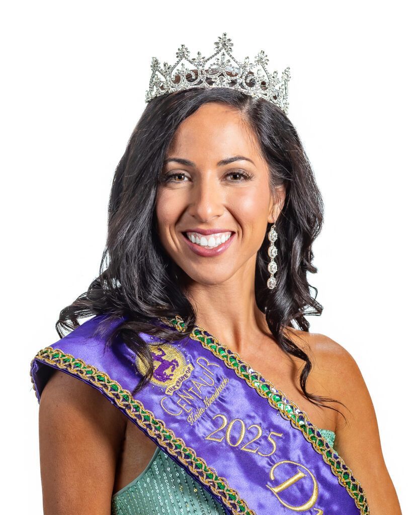 A woman wearing a tiara and a sash that says ' miss d ' on it