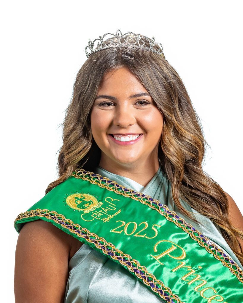 A woman is wearing a green sash and a tiara.