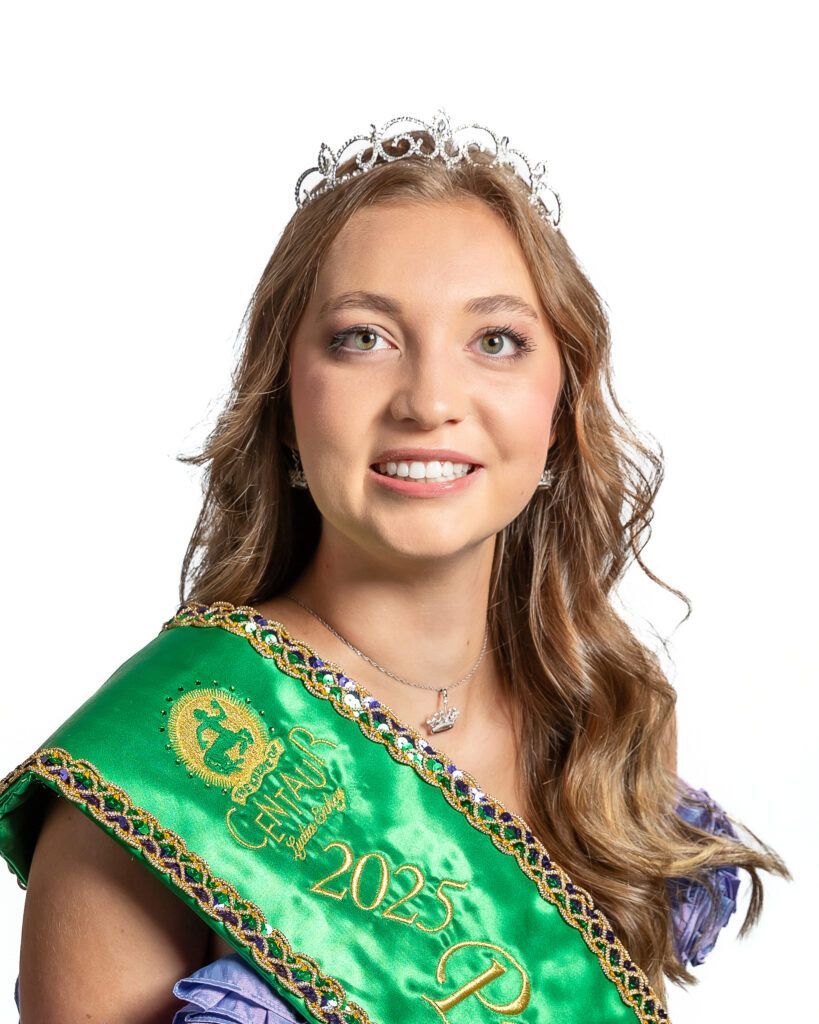 A woman is wearing a green sash and a tiara.