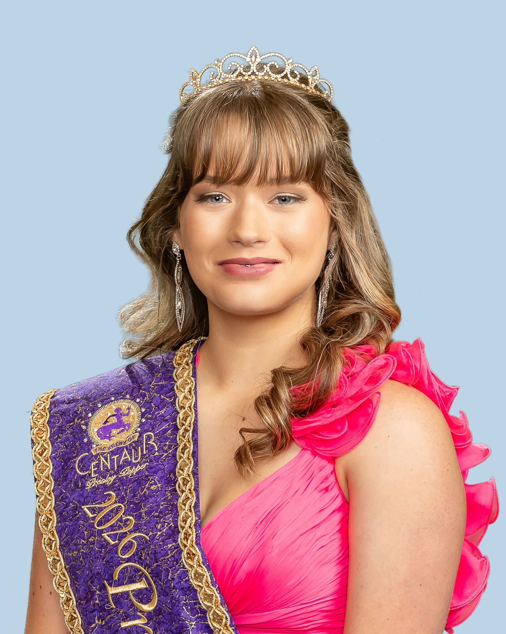 A woman wearing a purple sash and a tiara who is a princess. 
