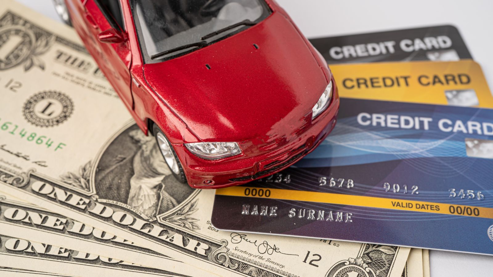 cash and credit card under toy car