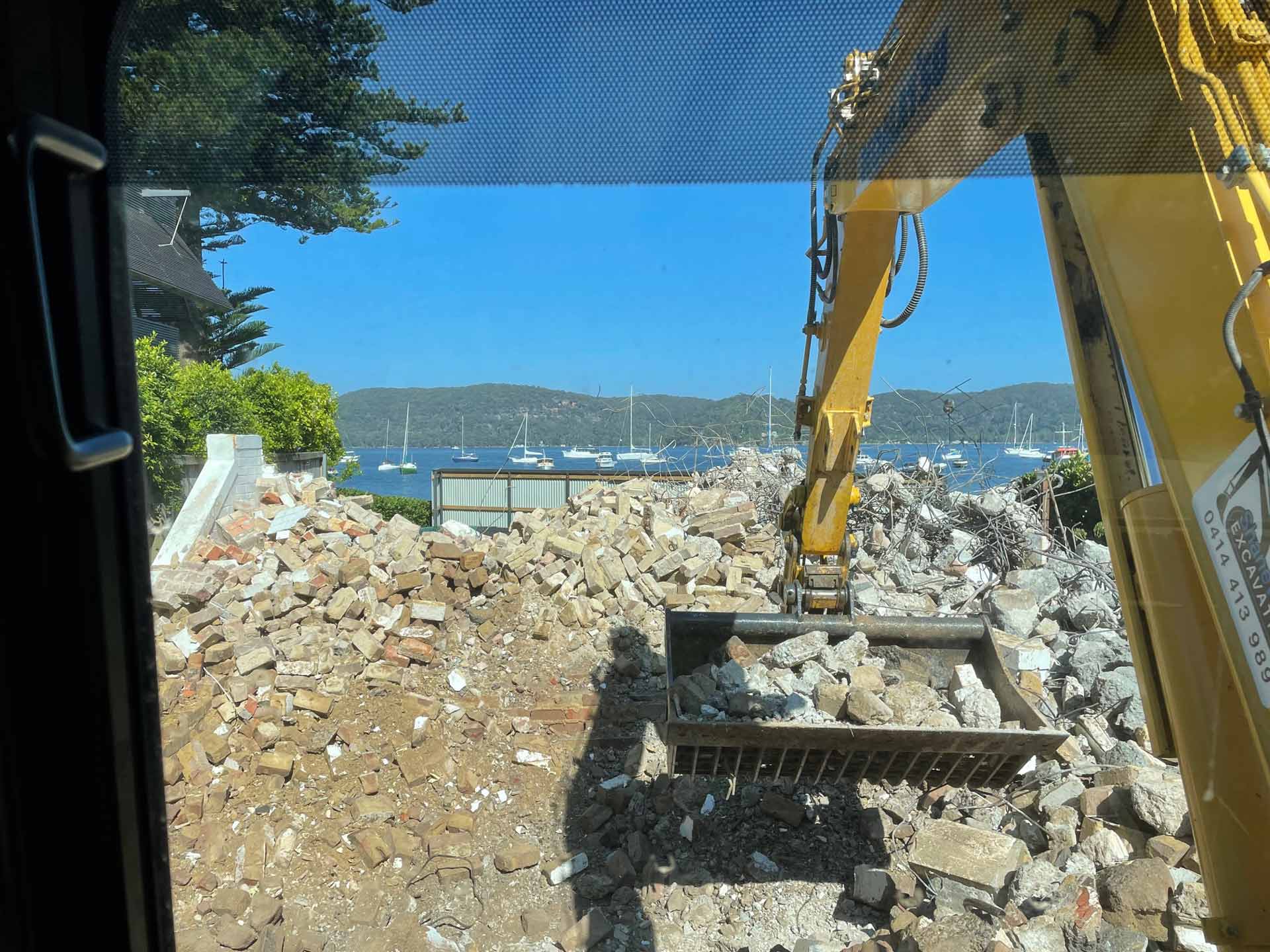 Excavator Claw with Rocks from House Wall | Belrose, Nsw | Shane Wight Excavation