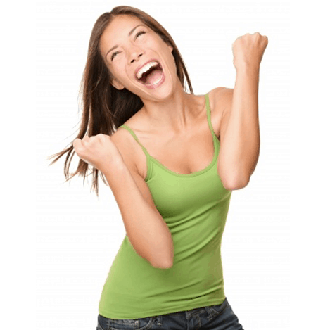 A woman in a green tank top is laughing with her fist in the air