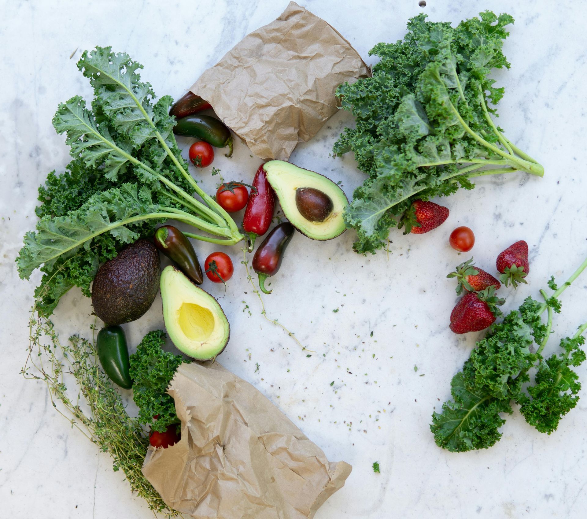 A variety of fruits and vegetables are on a table