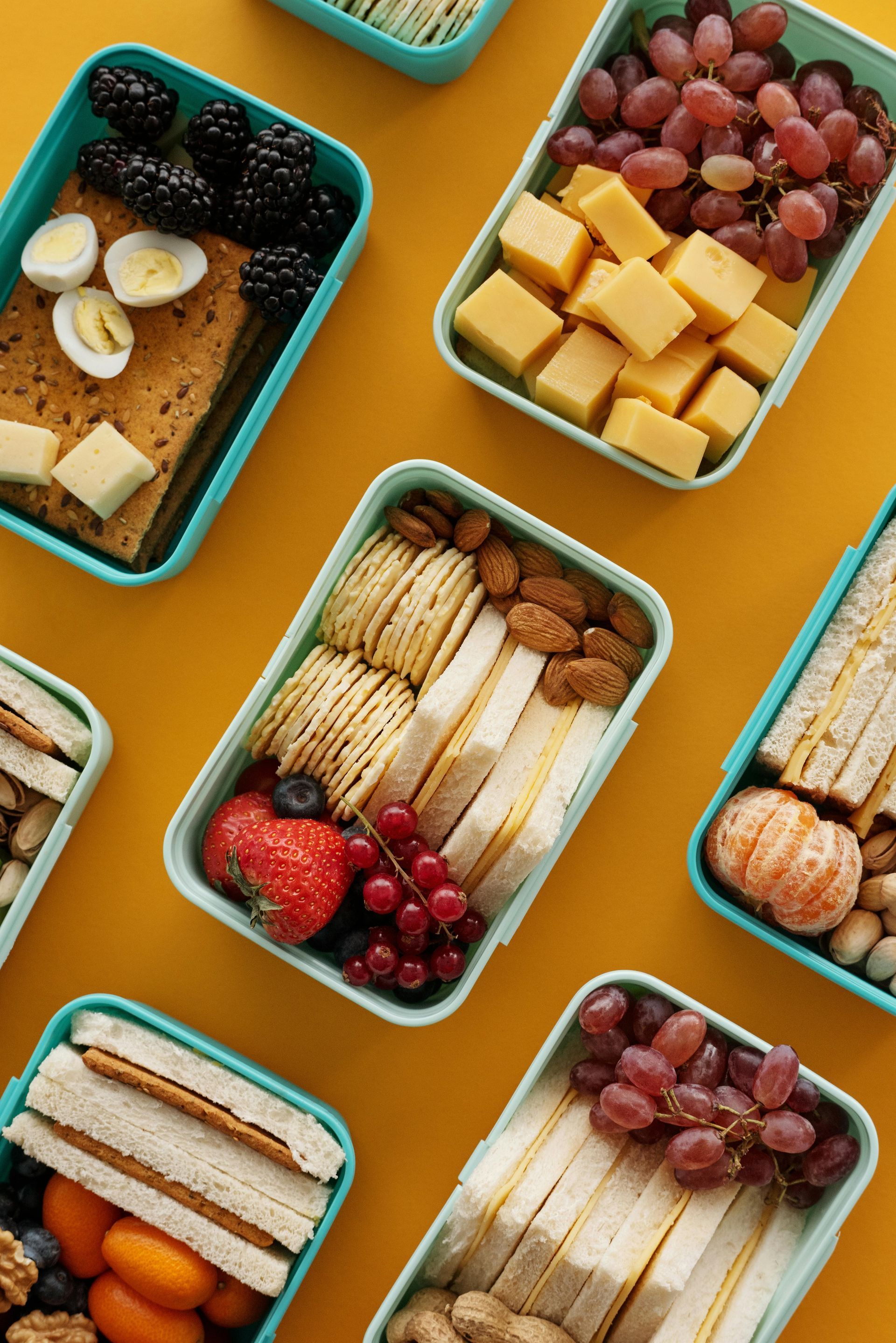 Mother organizing weekly meal prep with guidance from a nutrition accountability coach