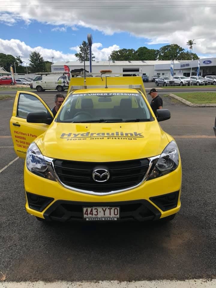 A Yellow Mazda Truck is Parked in a Parking Lot — FNQ Filters & Parts In Mareeba, QLD