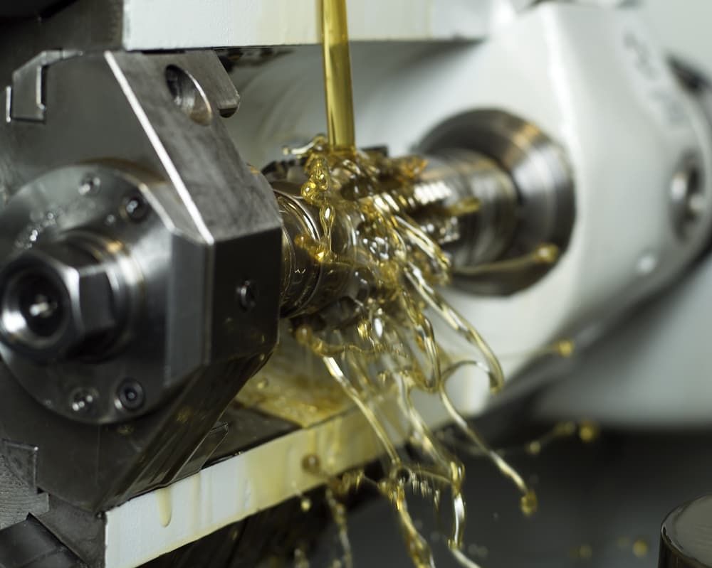 A Machine is Being Used to Cut a Piece of Metal — FNQ Filters & Parts In Mareeba, QLD