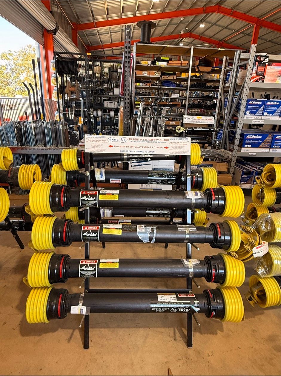 Black and yellow tractor parts — FNQ Filters & Parts In Mareeba, QLD