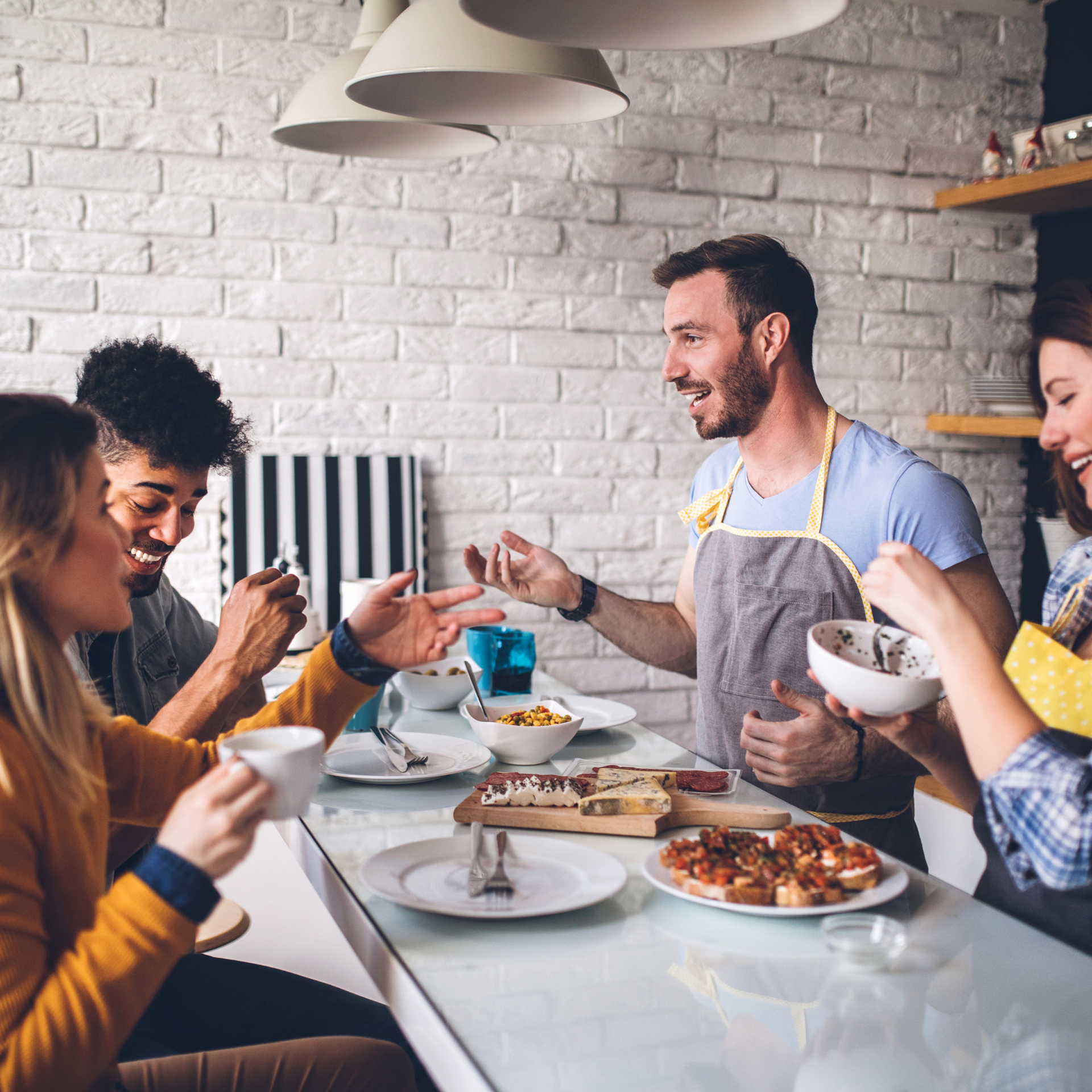 A group of people are sitting at a table eating food.