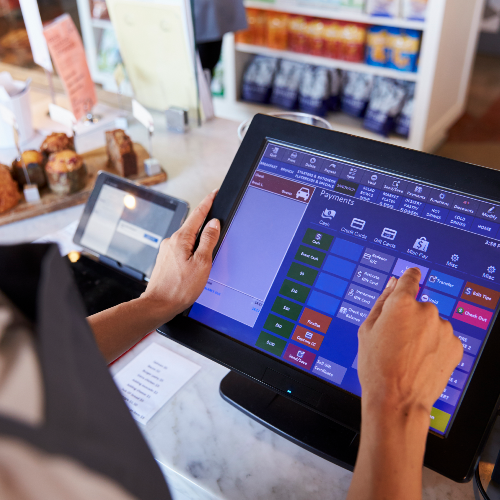 A person is using a tablet computer in a restaurant.