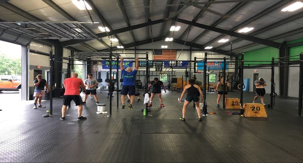 A group of people in the gym working out