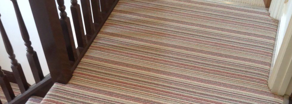stripey-carpeted hallway