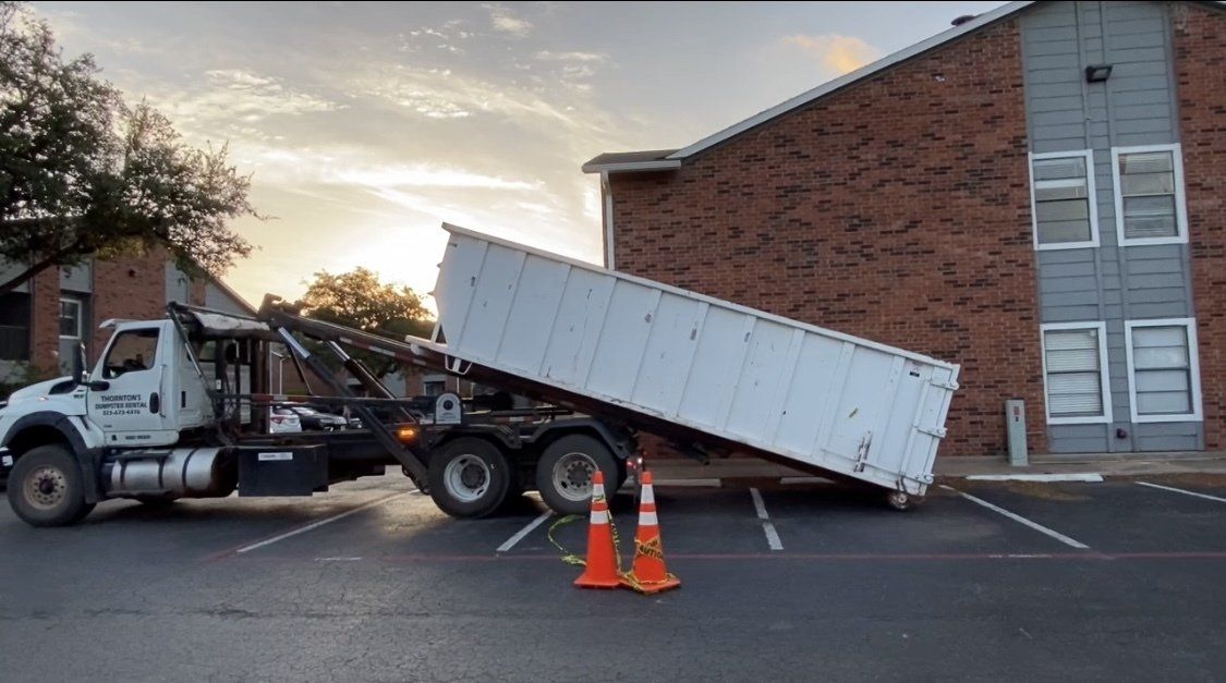 Truck and Dumpster on Lubbock, TX Property