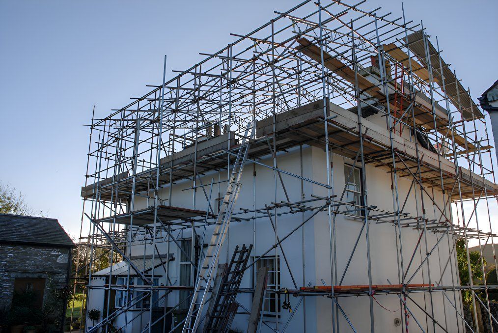 A House Is Being Built With Scaffolding Around It — Sno's Welding In Ciccone, NT