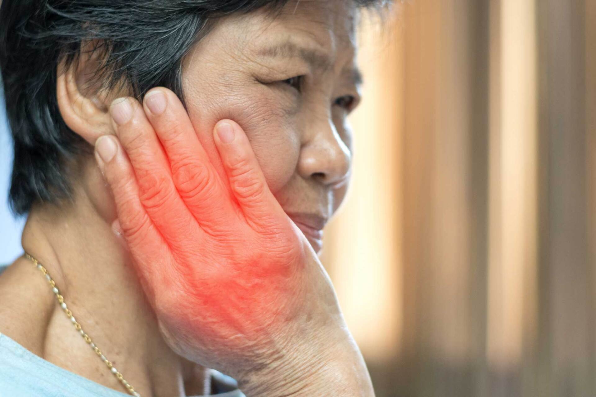 Woman Hand on Cheeks — Sylacauga, AL — O'Brien Family Dentistry