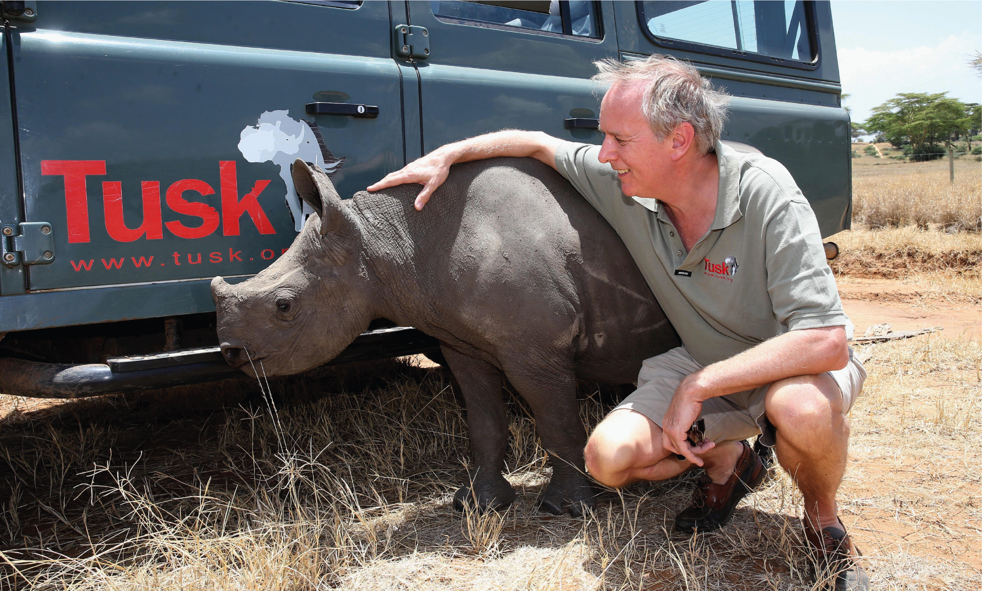 BlueRusk logo on the side of a Jeep, with a small rhino and man
