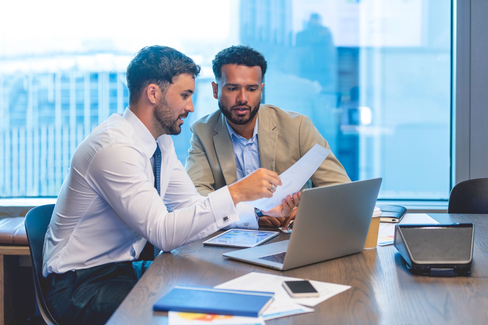 Business People Working On A Document — Spokane, WA — Omlin Gunning & Assoc Business People Working On A Document — Spokane, WA — Omlin Gunning & Assoc