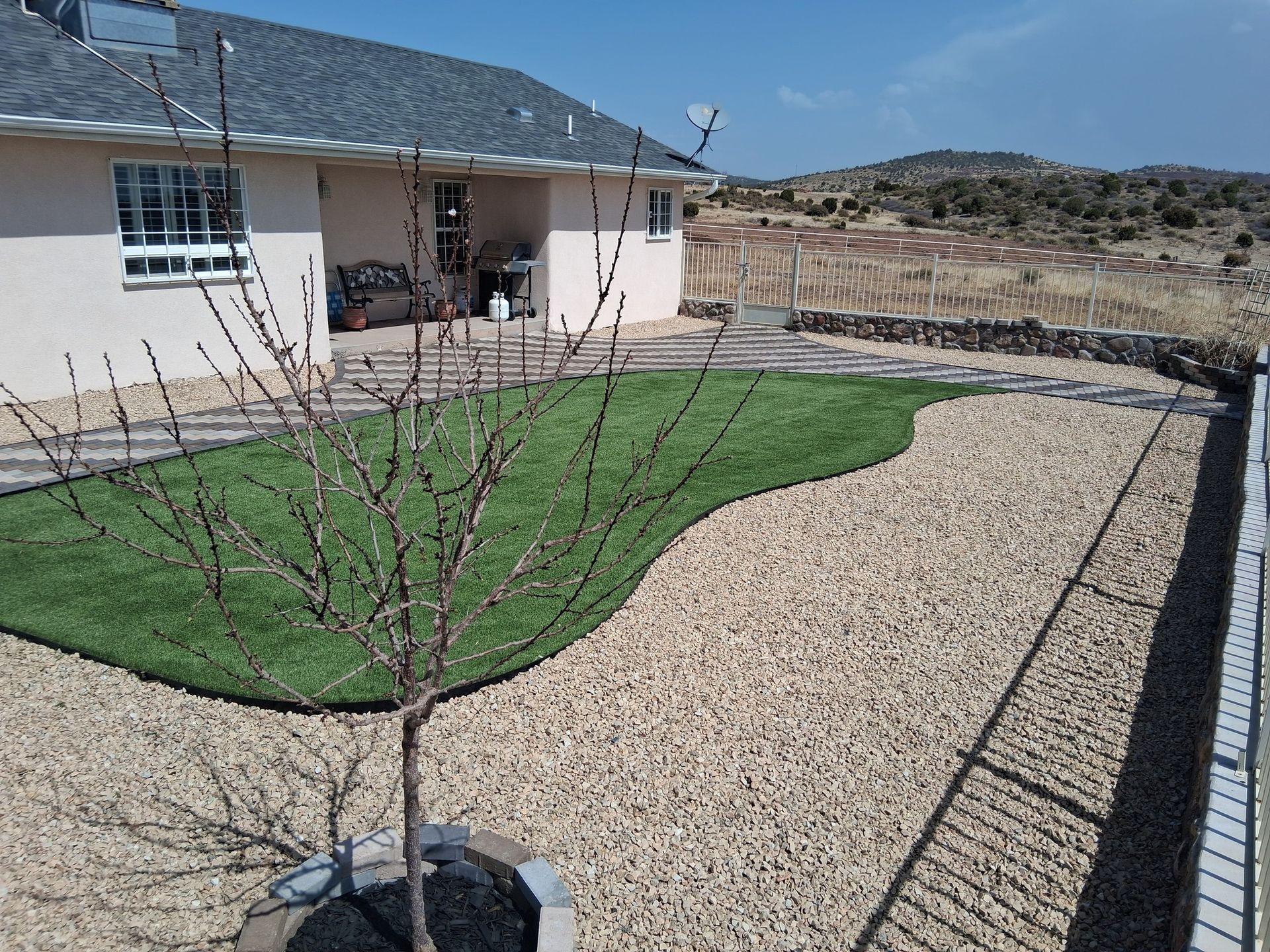 A house with a lot of grass in front of it