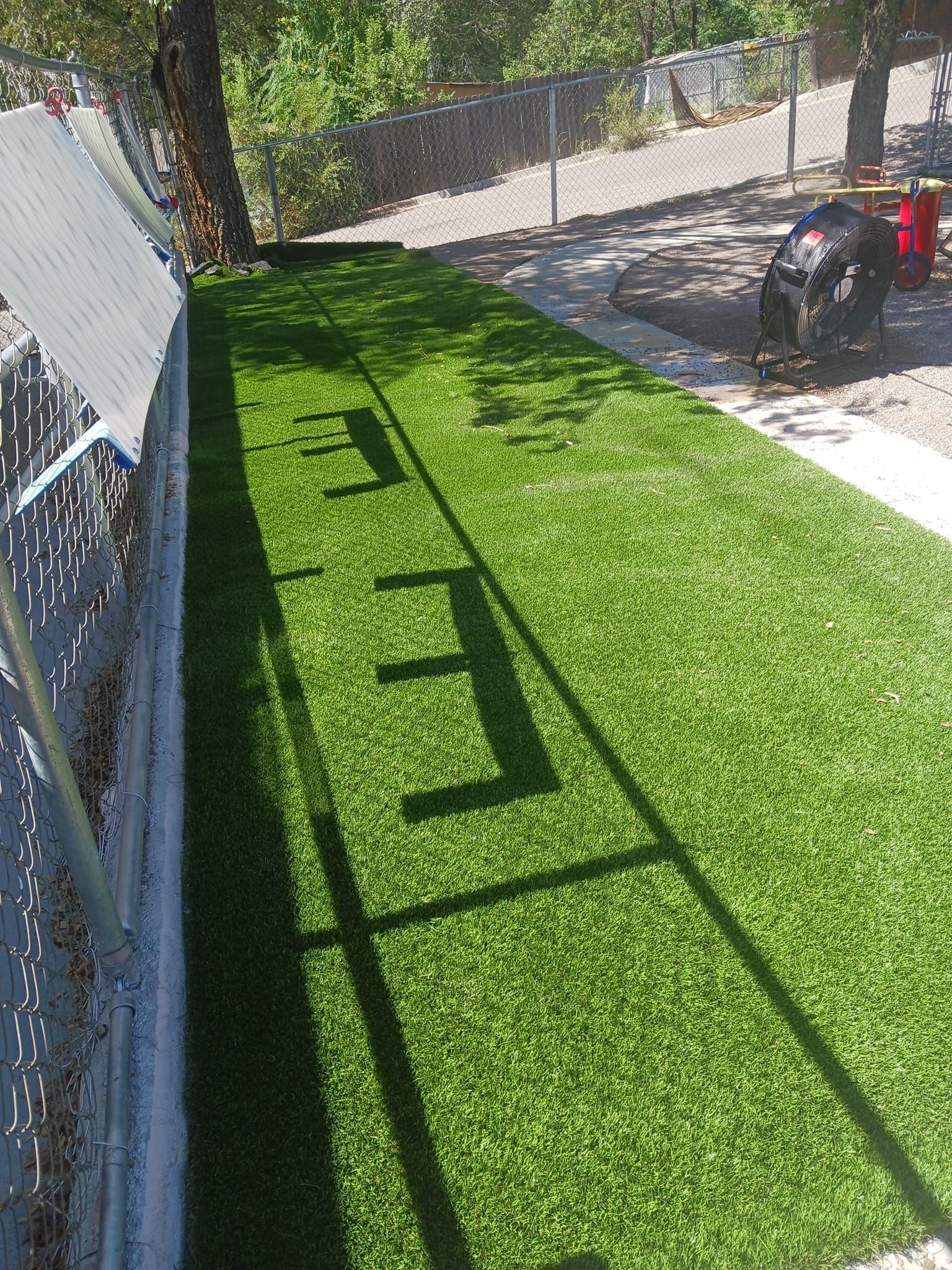 A sidewalk with a sign that says open on it