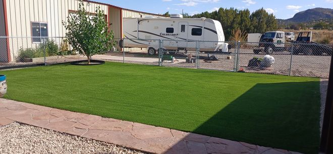A brick walkway is being built in front of a house