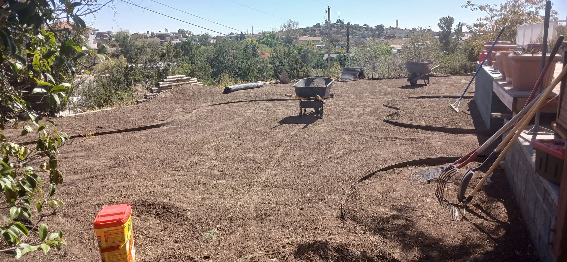A large pile of dirt is sitting on top of a hill.