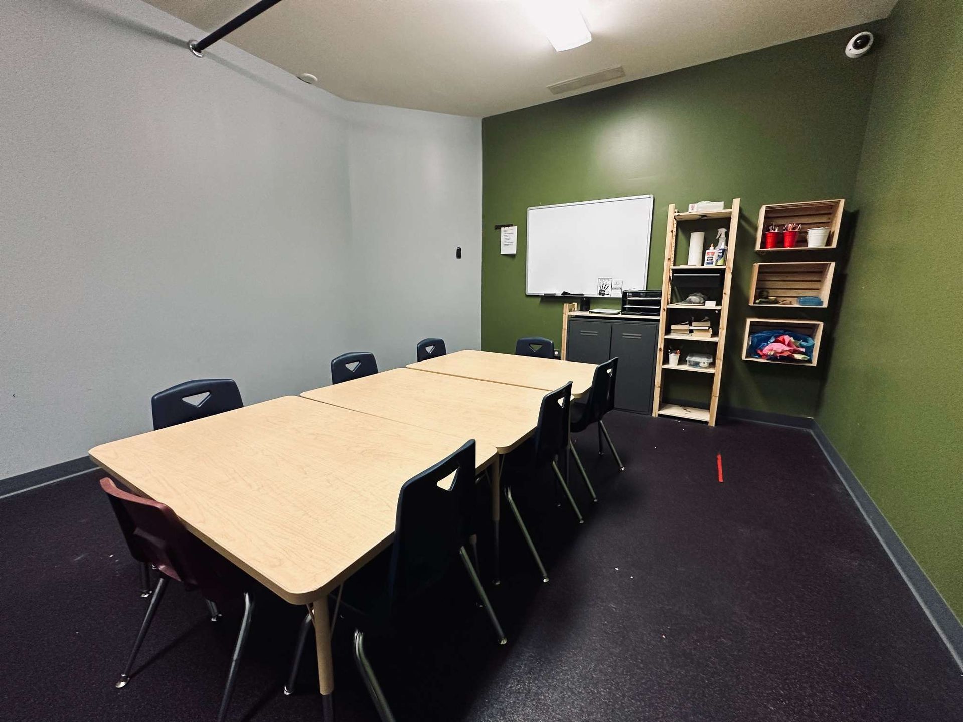 A conference room with a long table and chairs