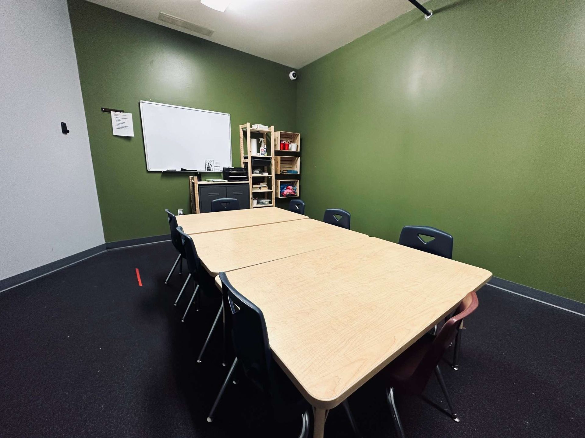 A conference room with a long table and chairs