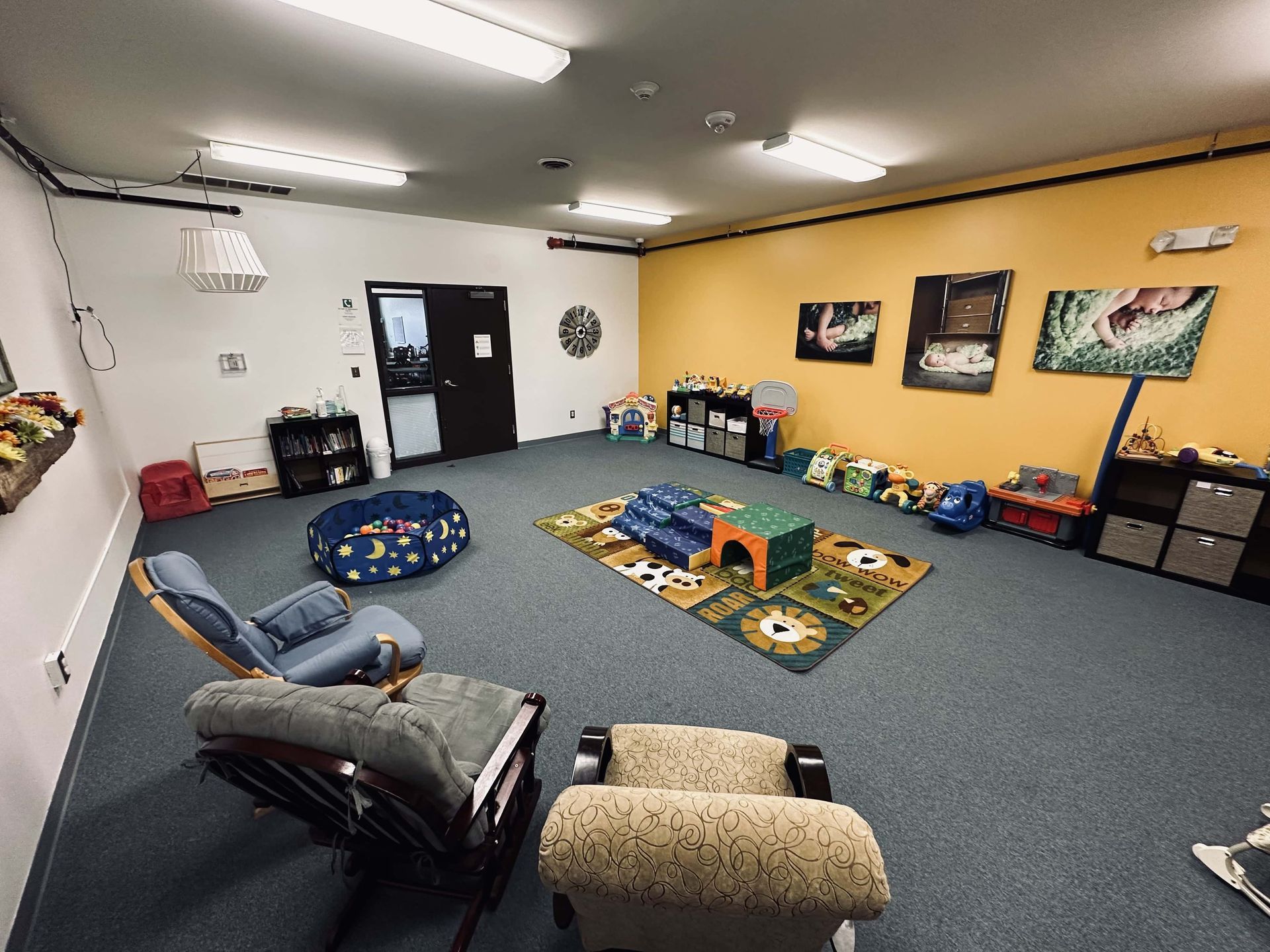 A large room with a lot of furniture and toys.