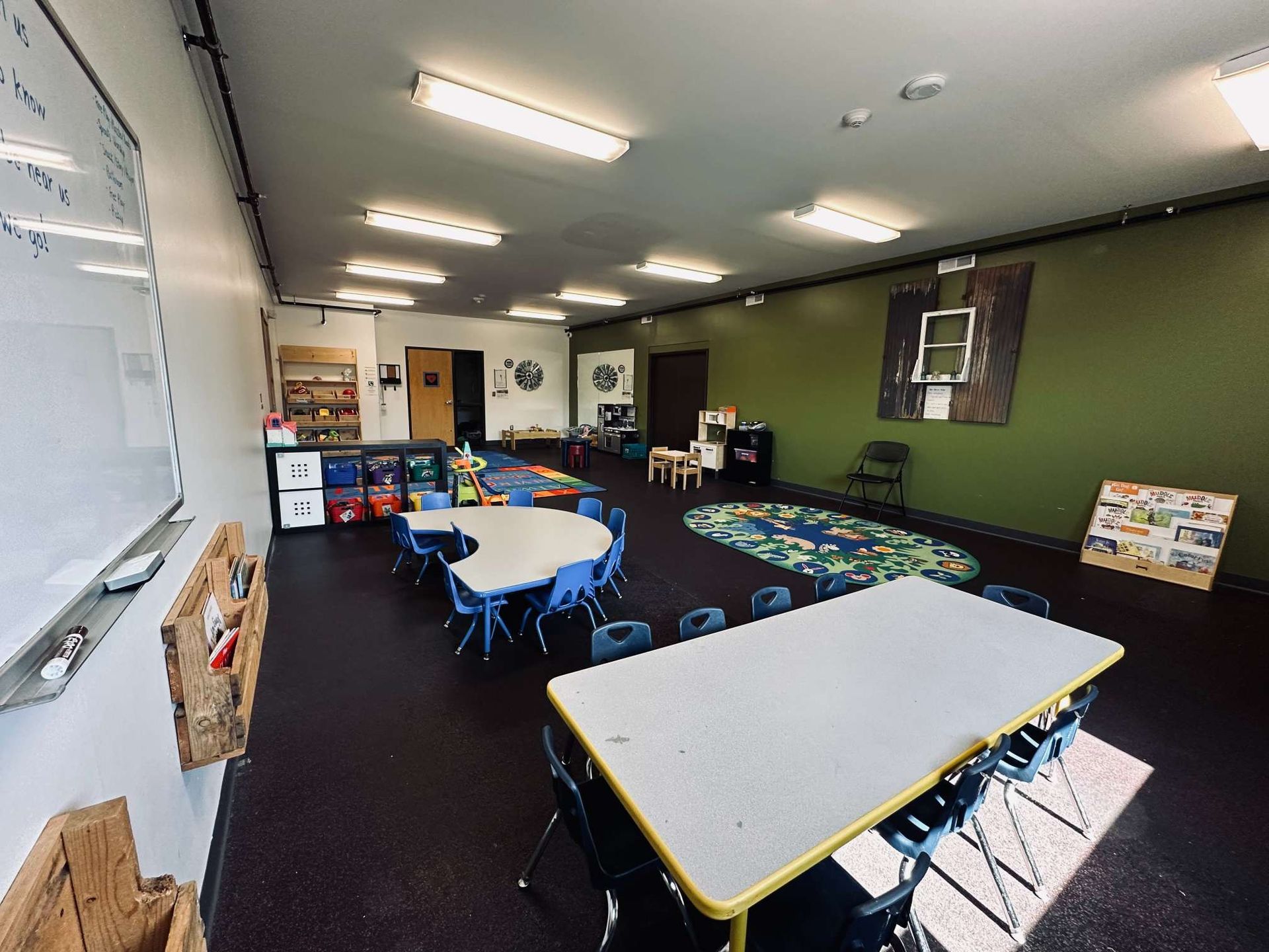 A large room with tables and chairs in it