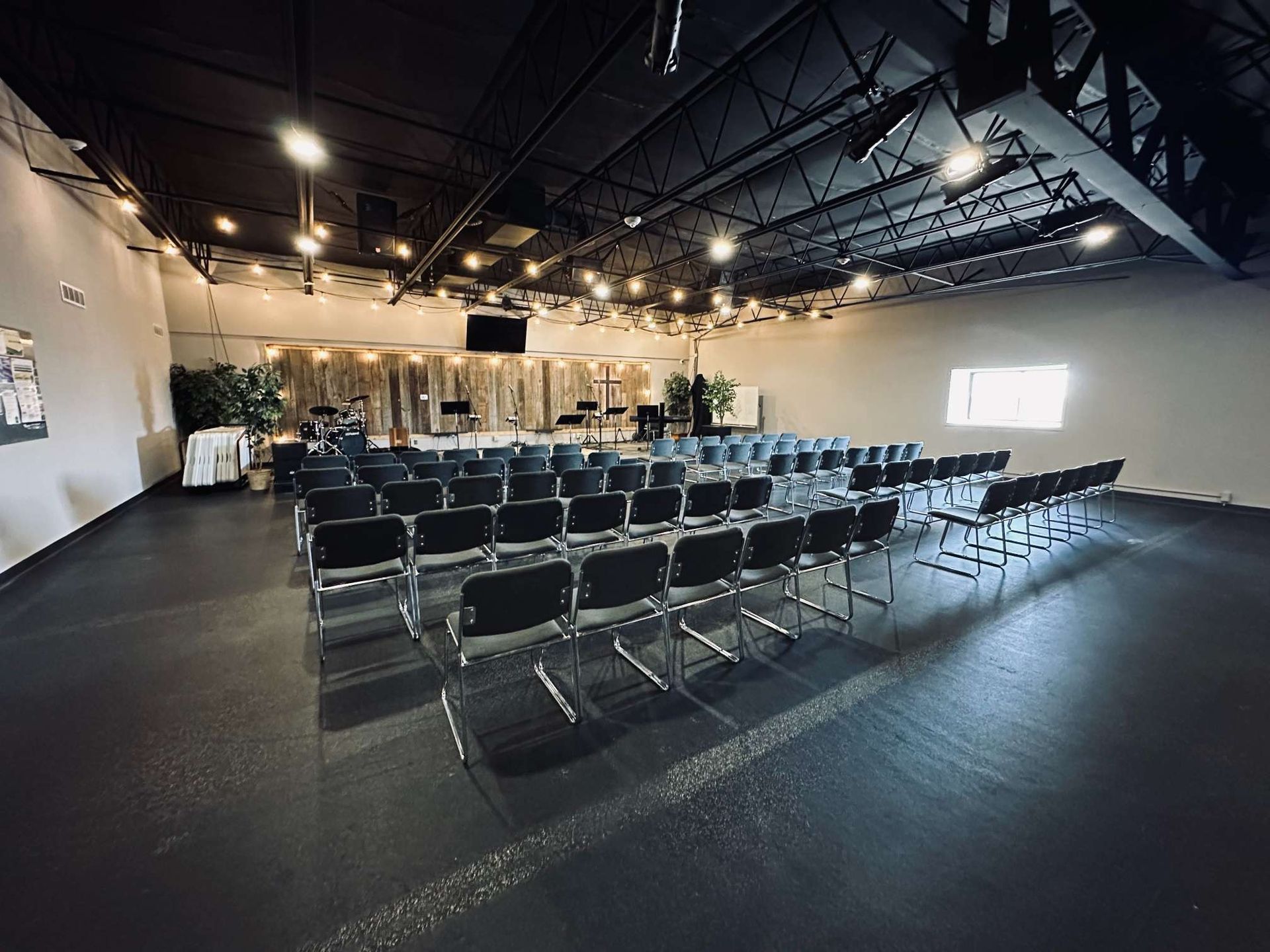 A large room with rows of chairs in it.