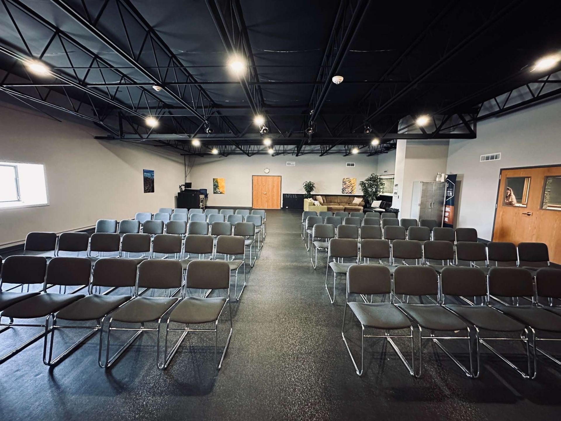 A large room with rows of chairs in it