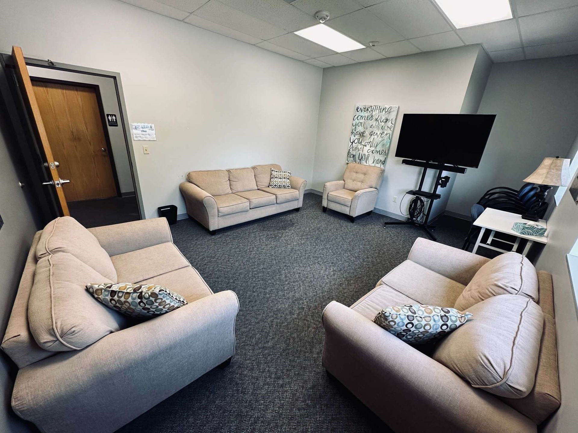 A living room filled with furniture and a flat screen tv.
